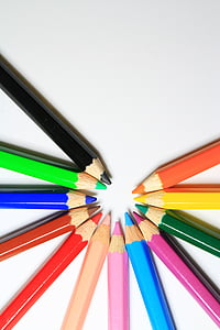 assorted-color color pencils on white surface thumbnail
