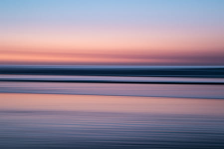 body of water under cloudy sky thumbnail