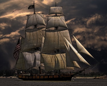 brown and white pirate ship on body of water during sunset thumbnail