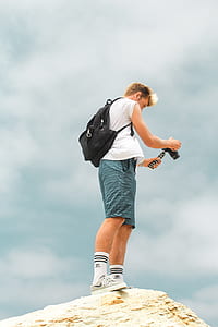 woman holding camera thumbnail