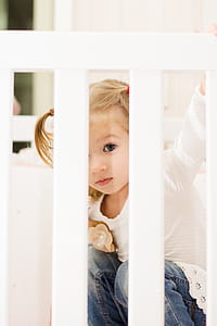 Girl Sitting in Crib thumbnail