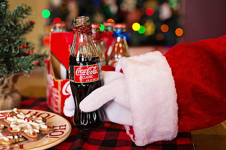 Santa Claus holding Coca-Cola Classic bottle thumbnail