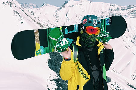 person holding black snowboard thumbnail