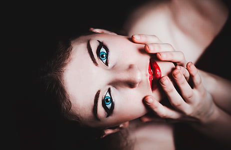 low-light photography of woman face thumbnail