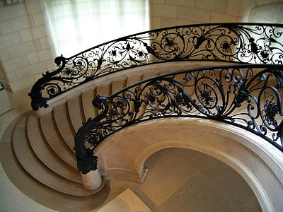 brown concrete stair with black metal handrail thumbnail