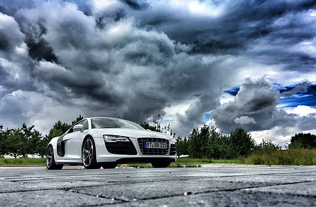 silver Audi R8 parked on open field under gray clouds thumbnail