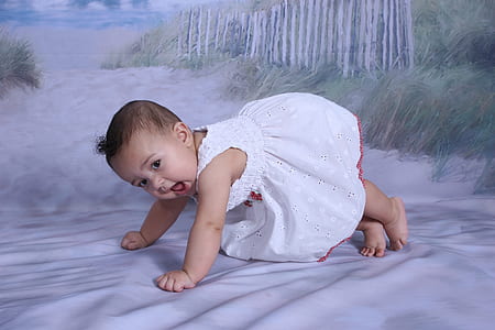 baby's wearing white floral dress planking on floor thumbnail