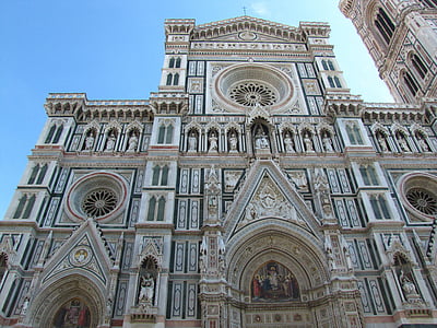 low-angle photo of white cathedral at daytime thumbnail