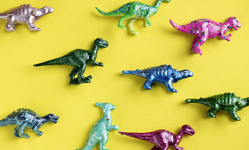 assorted-color dinosaur figurines thumbnail