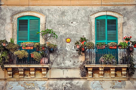 two teal wooden window shutters thumbnail