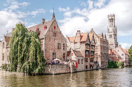 concrete houses beside body of water thumbnail