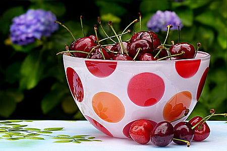 cherries in round white and red polka-dot glass bowl thumbnail