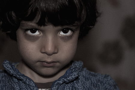 boy wearing blue knit shirt thumbnail