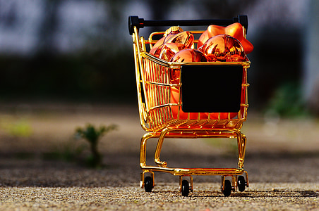 shopping cart of ornaments miniature on ground selective focal photo thumbnail