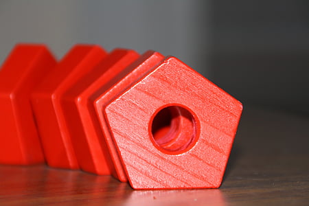 macro shot photography of red wooden tool thumbnail