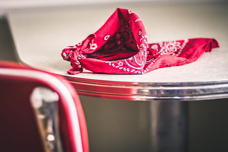Red Paisley Handkerchief on Gray and White Table thumbnail