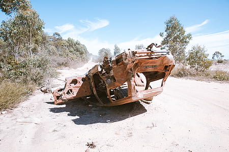 ruined vehicle on gray road thumbnail
