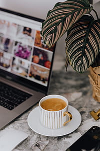 Coffee in a cup on a marble desk thumbnail