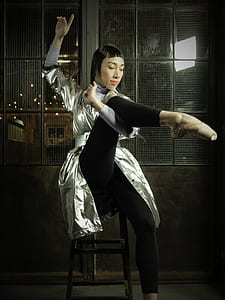 woman sitting on chair while stretching thumbnail