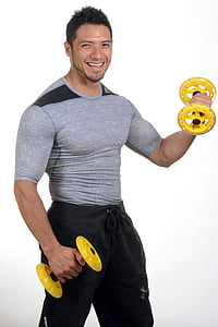 man wearing grey crew-neck shirt holding yellow and black dumbbells thumbnail