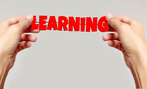 person holding learning signage thumbnail
