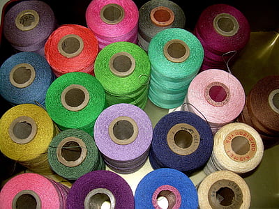 assorted color thread spools thumbnail