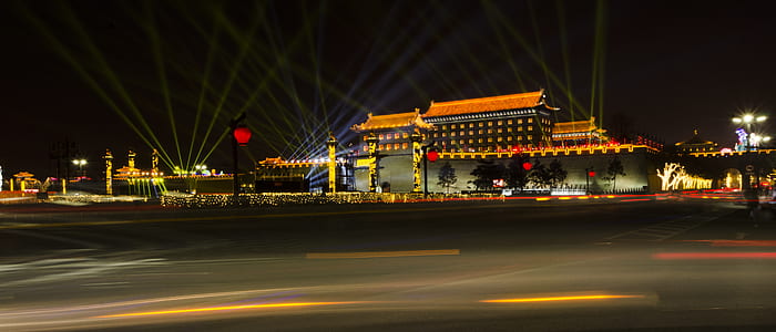 white and orange building during nighttime thumbnail