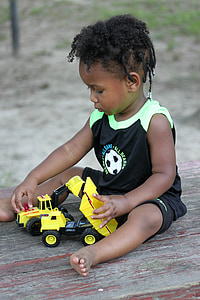 boy playing truck toy thumbnail