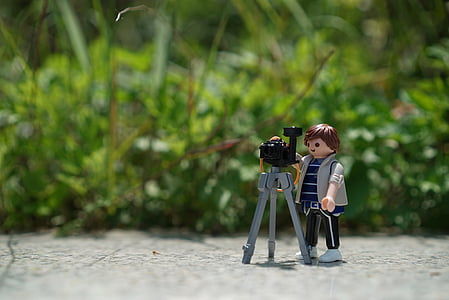 tilt photography of man performing laser level Lego toy thumbnail