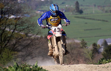 man riding motocross dirt bike thumbnail