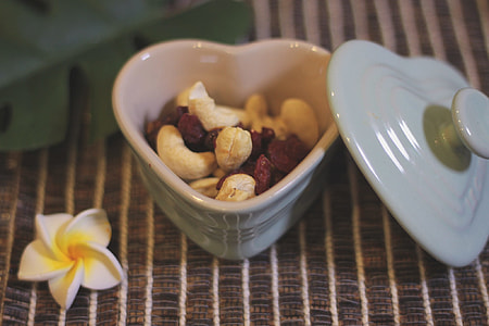 white ceramic heart shape bowl with beans inside thumbnail