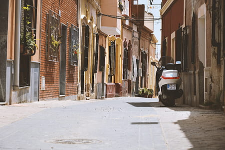 gray motor scooter at parking area thumbnail