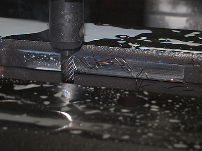 black hand drill on black metal surface thumbnail