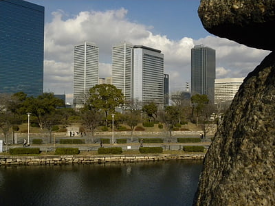 gray concrete buildings under white cloudy sky during daytime thumbnail