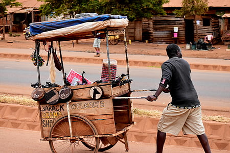 man pushing cart outdoor thumbnail
