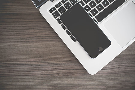 iPhone Lying on MacBook Keyboard thumbnail