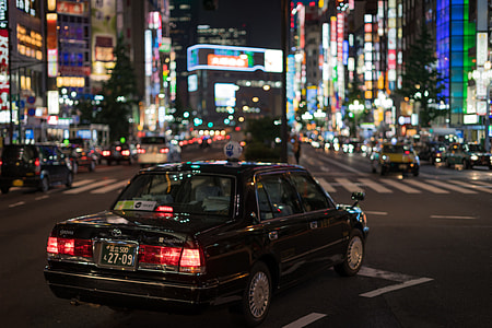 black sedan at the city thumbnail