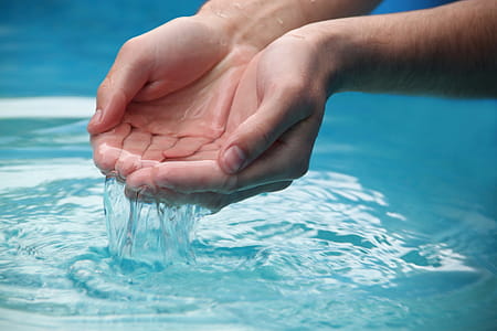 Person's Scooping Water by Hands thumbnail