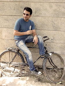 man sitting on bicycle thumbnail