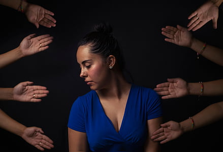 woman wearing blue V-neck cap-sleeved top thumbnail