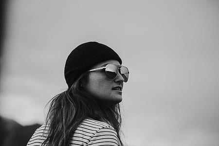 grayscale photography of woman wearing sunglasses thumbnail