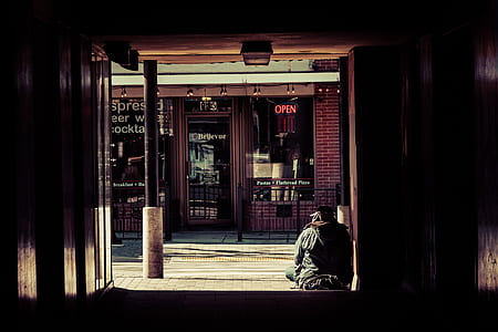 person sitting on floor near psot thumbnail