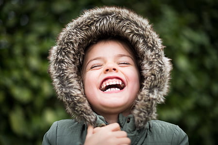 toddler holding hoodie and smiling thumbnail