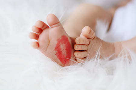 baby's foot on fur mattress thumbnail