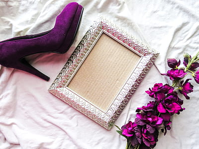 gray photo frame between purple petaled flowers and purple suede platform sandal thumbnail