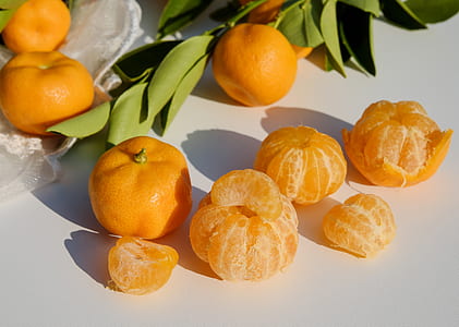 orange fruits on white surface thumbnail