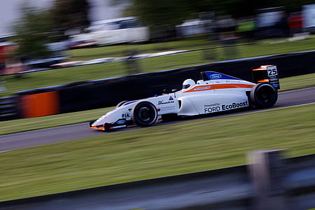 white Ford EcoBoost F1 race car time lapse photography during daytime thumbnail