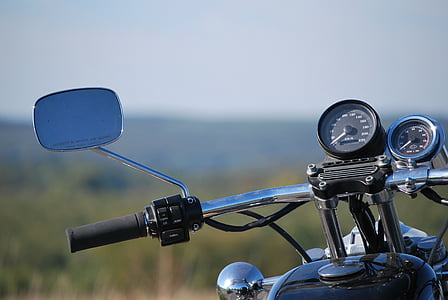 close-up photography of motorcycle by day thumbnail