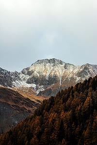 photo of gray and brown mountain range under clear sky thumbnail