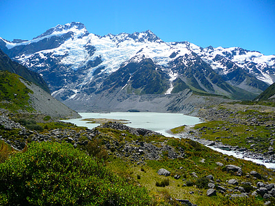 mountain range beside water thumbnail
